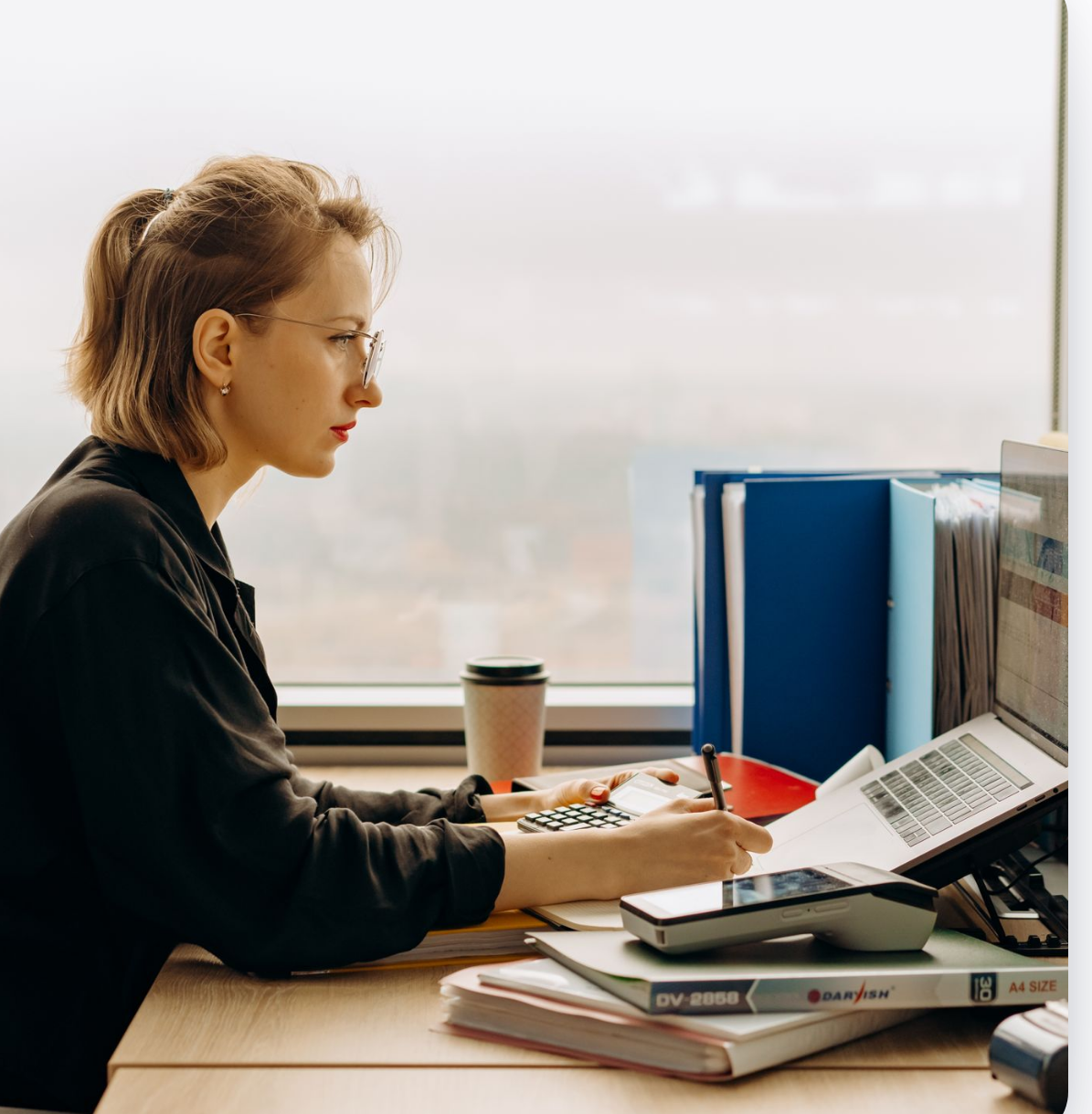 An accounting professional earning CPE on a laptop at her desk